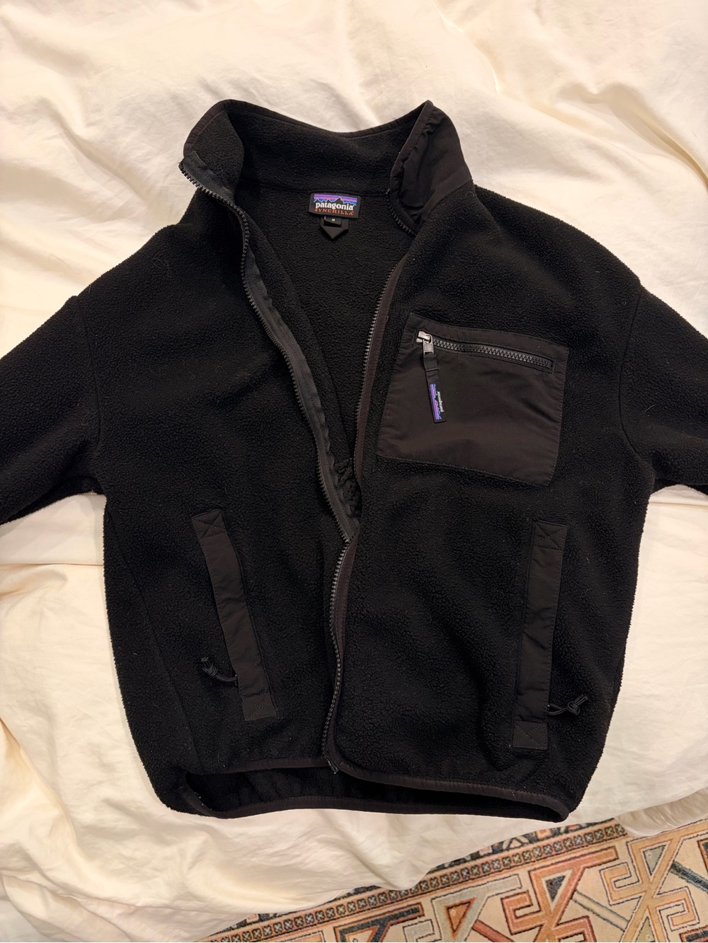 Patagonia Black Fleece Syncilla Jacket with Purple Logo Accent